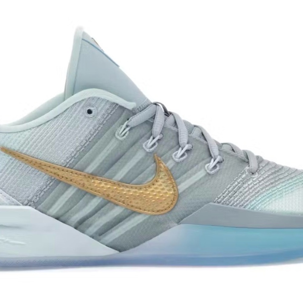Nike Light Gray Low-Top Sneaker with Gold Swoosh